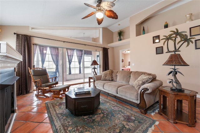 living room featuring tile patterned floors, ceiling fan, and vaulted ceiling