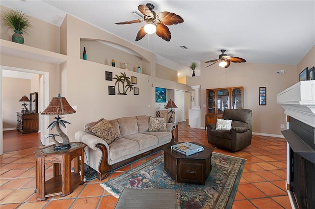 tiled living room with ceiling fan and lofted ceiling