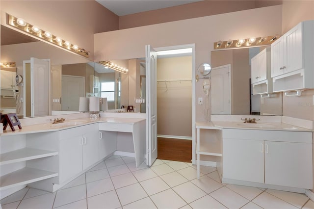 bathroom with tile patterned flooring and vanity