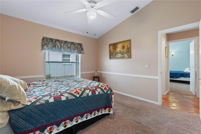 bedroom with carpet flooring, ceiling fan, and vaulted ceiling