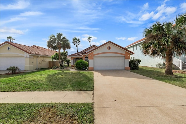 view of front of property featuring a front yard and a garage