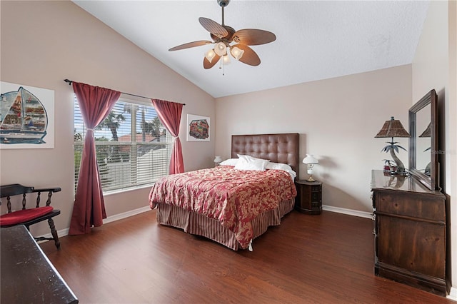 bedroom with lofted ceiling, ceiling fan, and dark hardwood / wood-style floors