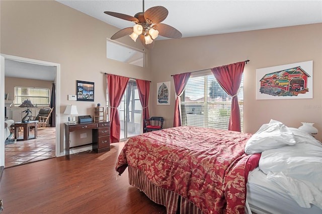 bedroom with hardwood / wood-style floors, ceiling fan, and lofted ceiling