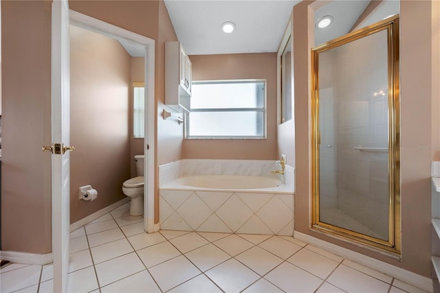 bathroom featuring plus walk in shower, tile patterned flooring, and toilet