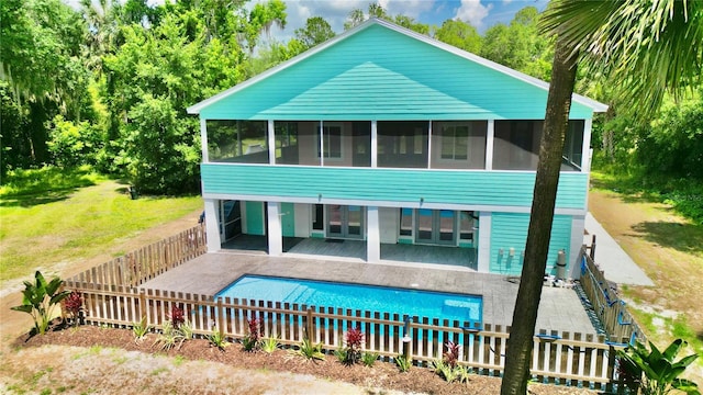 view of front of property featuring a patio area and a sunroom