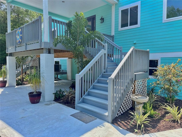 view of exterior entry featuring a wooden deck