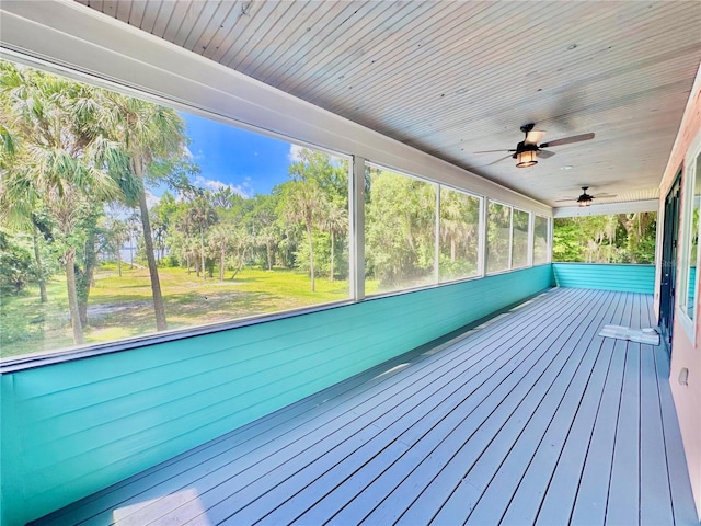 wooden terrace featuring ceiling fan