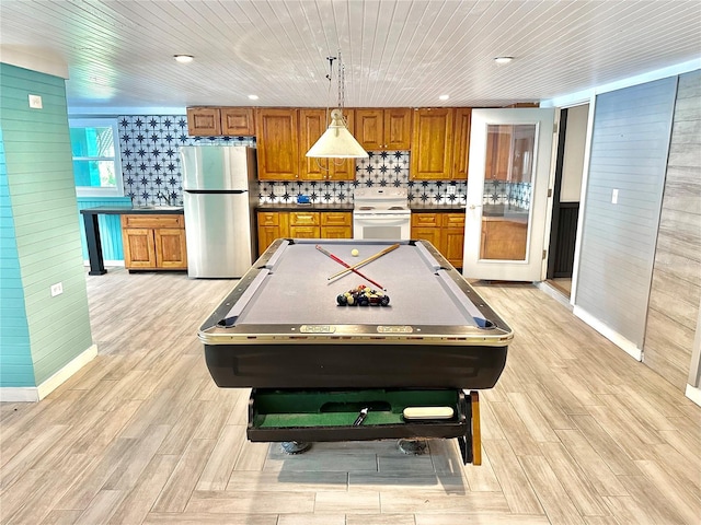 rec room featuring wooden ceiling, light hardwood / wood-style floors, wooden walls, and billiards