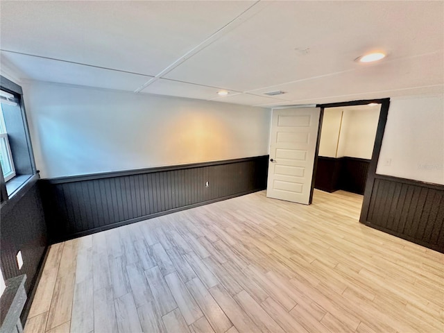 spare room with light hardwood / wood-style floors