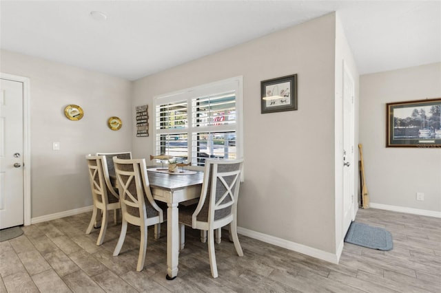 dining space with light wood-type flooring