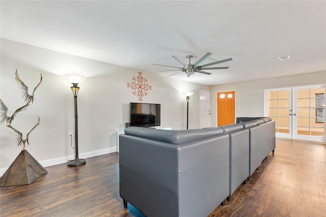 living room with french doors, dark hardwood / wood-style flooring, and ceiling fan