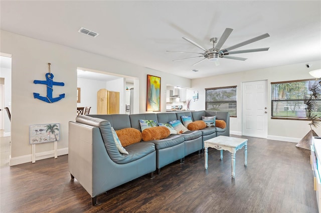 living room featuring dark hardwood / wood-style floors and ceiling fan