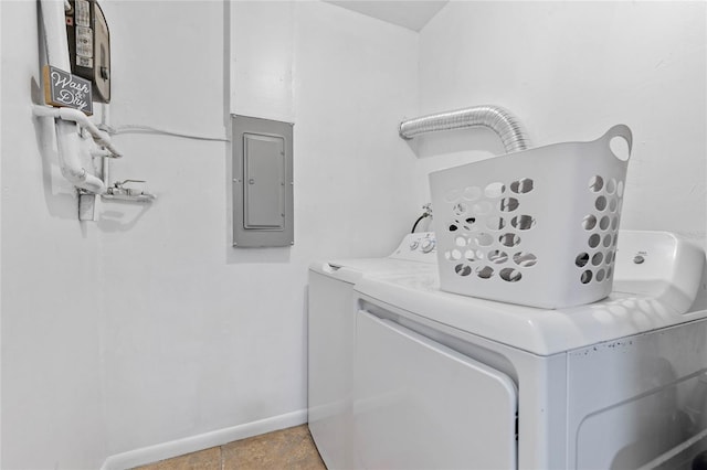 clothes washing area featuring independent washer and dryer and electric panel