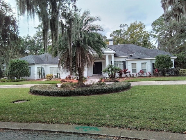 view of front of home with a front yard