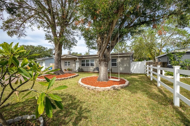 back of house featuring a yard