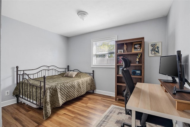 bedroom featuring hardwood / wood-style floors