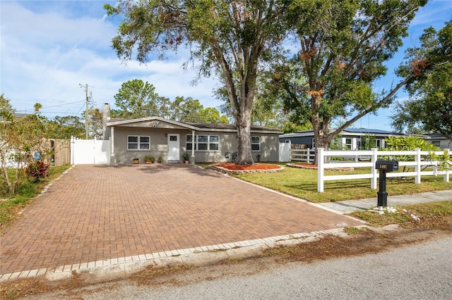 ranch-style house with a front yard