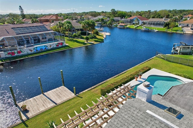 birds eye view of property with a water view