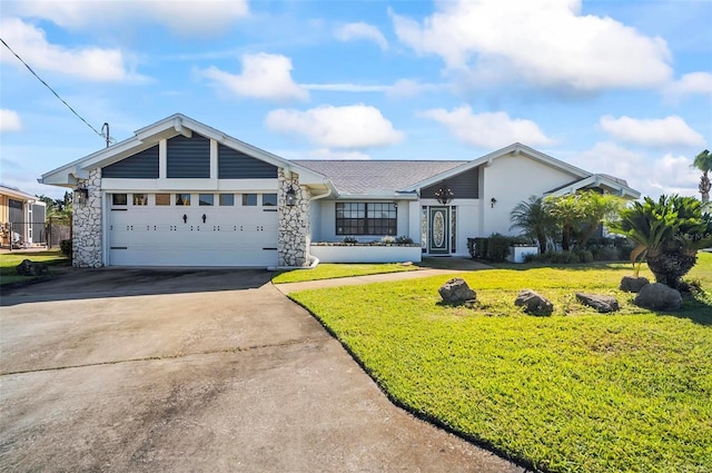 ranch-style house with a garage and a front lawn