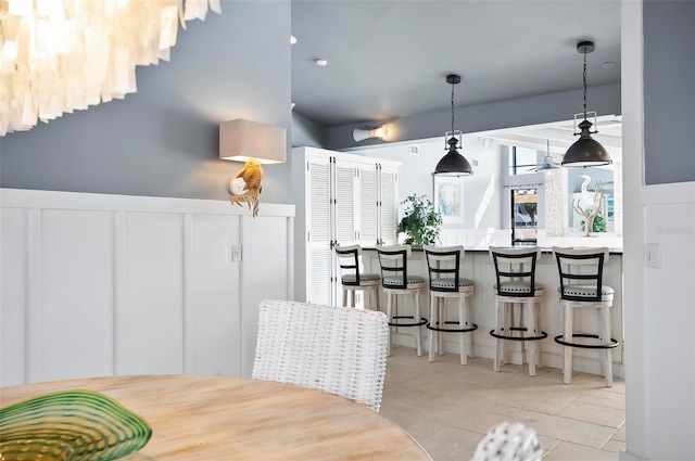 dining space featuring light tile patterned flooring