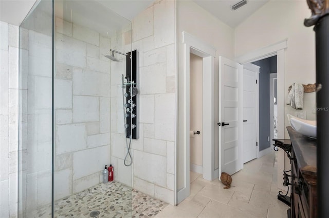 bathroom with a tile shower