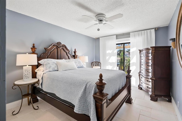 bedroom featuring light tile patterned floors, a textured ceiling, and ceiling fan