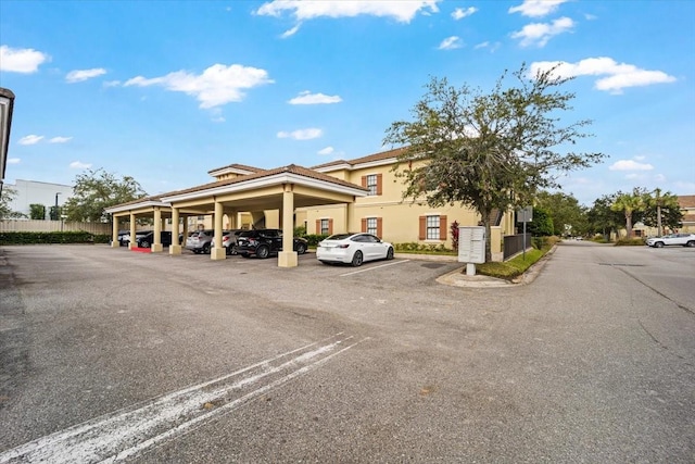 view of partially covered parking lot