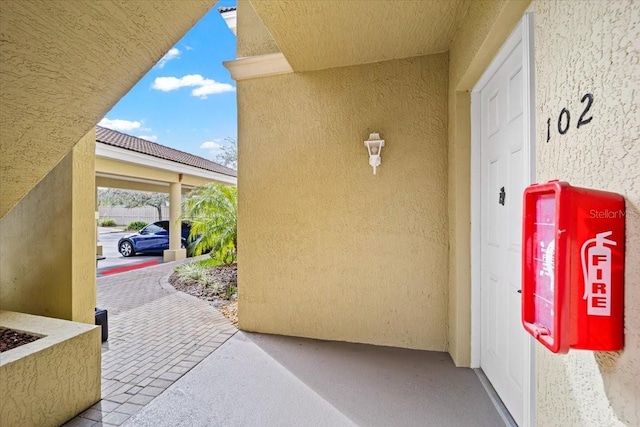 property entrance featuring stucco siding