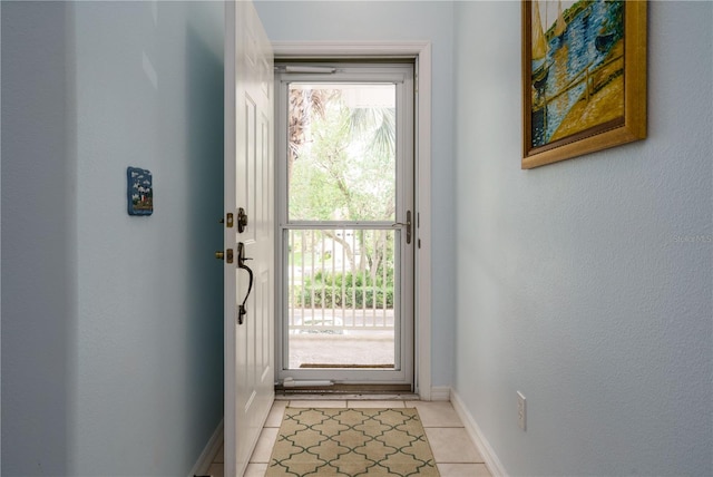 doorway featuring light tile patterned flooring