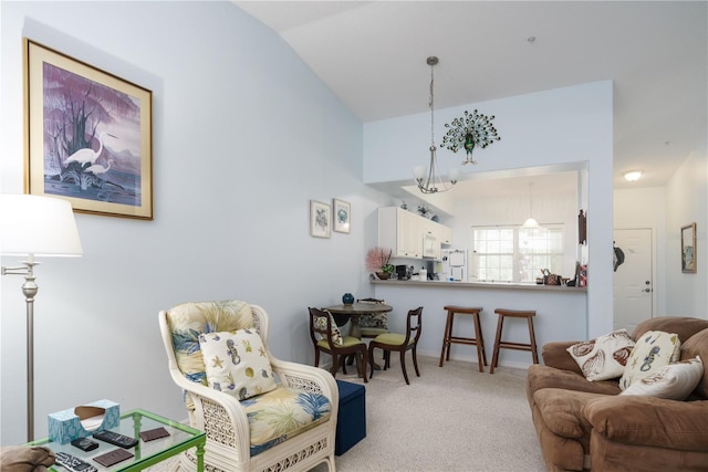 interior space with a notable chandelier and vaulted ceiling