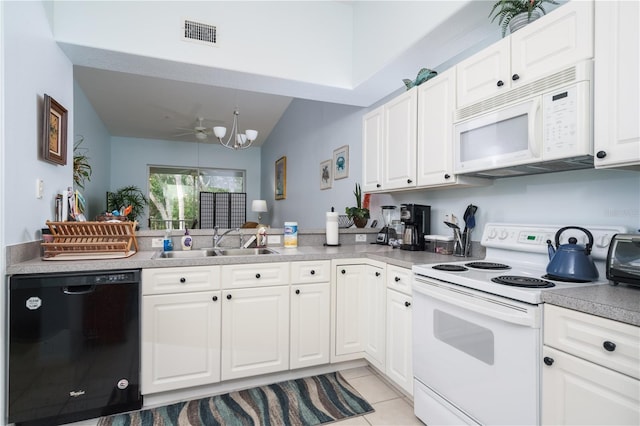 kitchen with white cabinetry, white appliances, sink, and vaulted ceiling