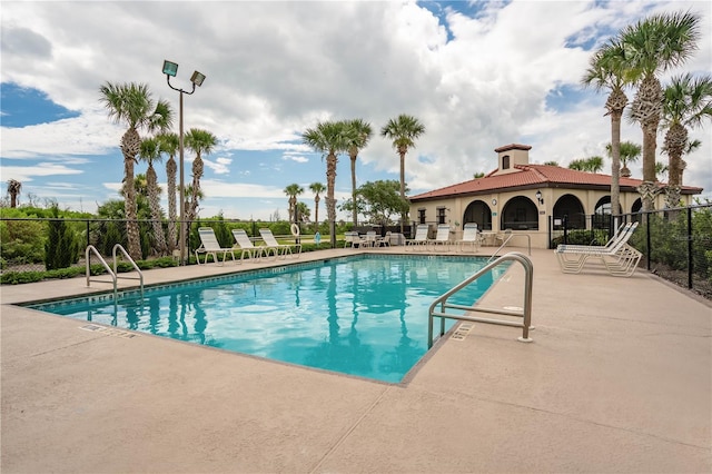 view of swimming pool with a patio area