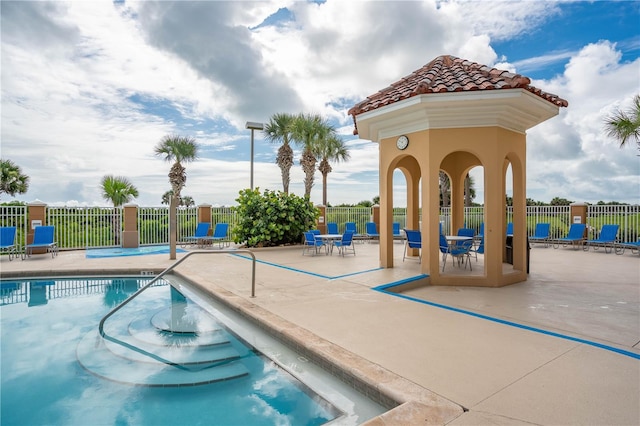 view of swimming pool featuring a patio area