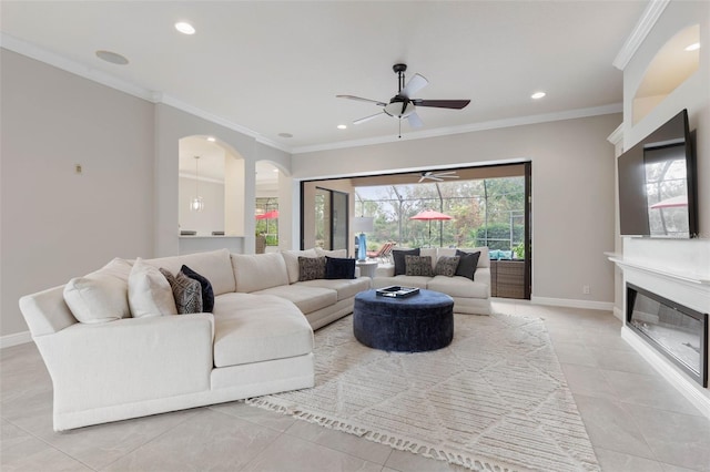 living room with ceiling fan, light tile patterned floors, and crown molding