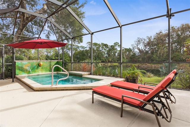 view of pool featuring glass enclosure, a patio area, and a jacuzzi