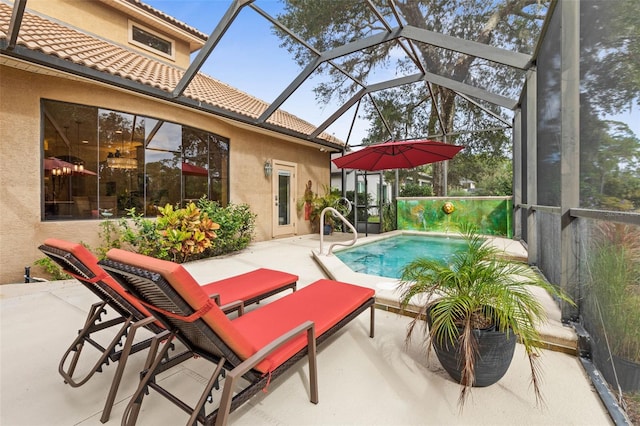 view of pool featuring a patio and glass enclosure