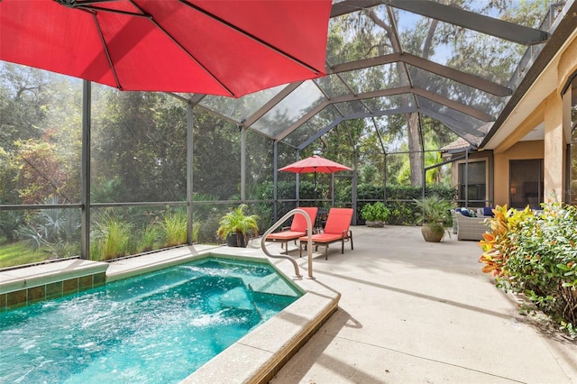 view of pool featuring a lanai, a patio area, and pool water feature