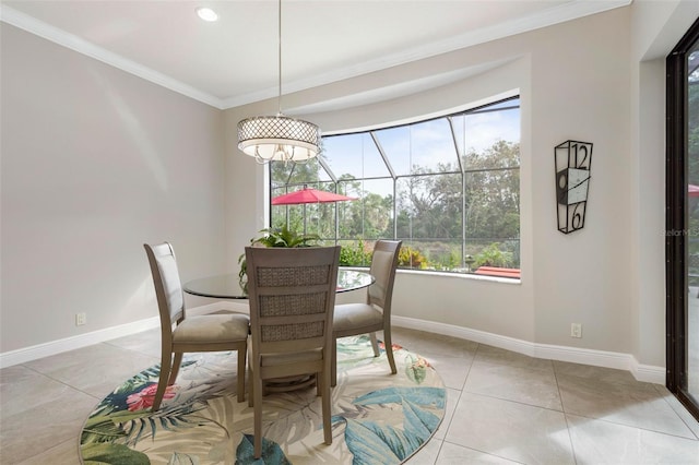 dining room with light tile patterned floors and crown molding