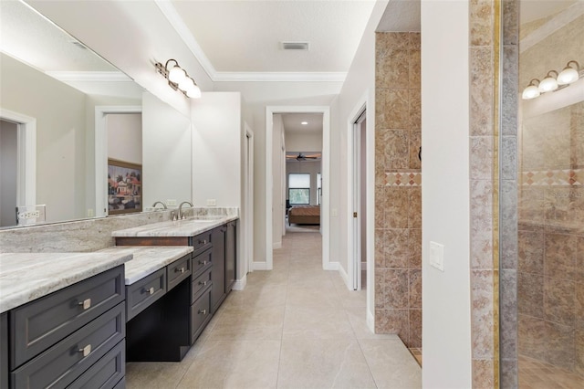 bathroom featuring tile patterned flooring, vanity, ceiling fan, and ornamental molding