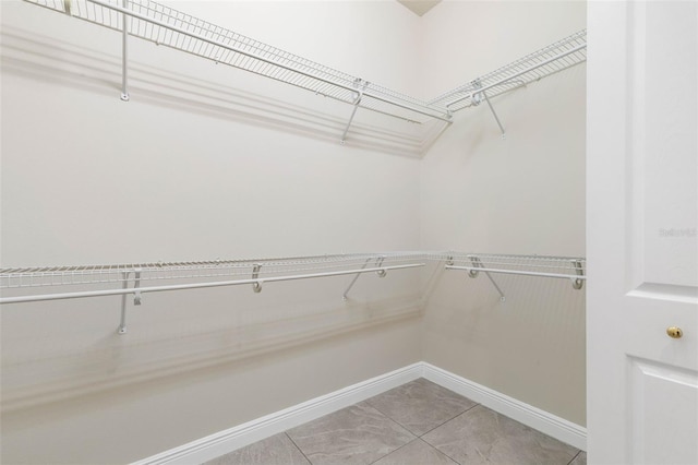 walk in closet featuring tile patterned floors