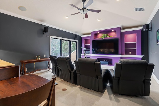 carpeted cinema with ceiling fan and ornamental molding