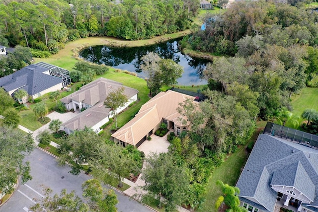 birds eye view of property with a water view