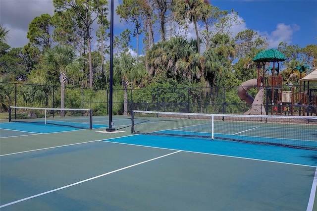 view of tennis court featuring basketball court