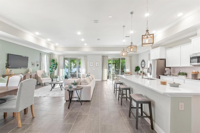 interior space with ornamental molding and sink