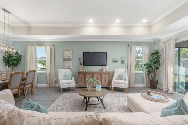 2214 Elegant Manor Cir, Edgewater, FL 32141 - living area with a tray ceiling, crown molding, a chandelier, and recessed lighting