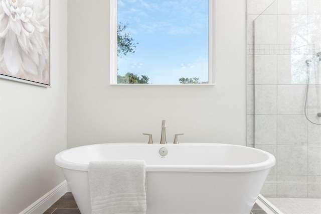 2214 Elegant Manor Cir, Edgewater, FL 32141 - full bathroom featuring a freestanding bath and a tile shower