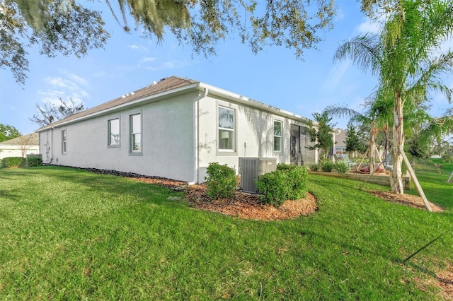 2214 Elegant Manor Cir, Edgewater, FL 32141 - view of home's exterior featuring stucco siding and a yard