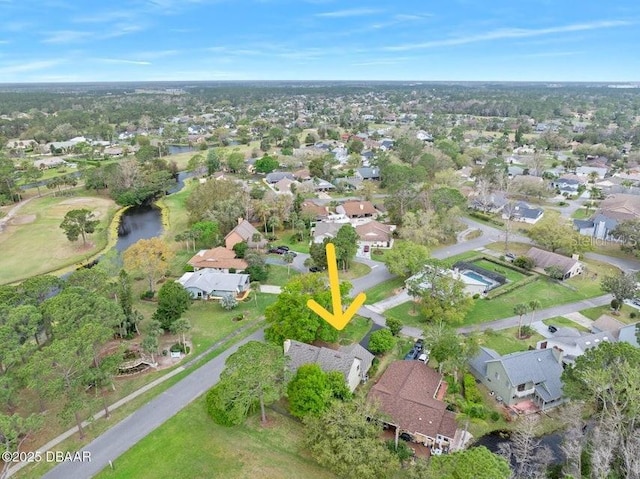 birds eye view of property with a residential view and a water view