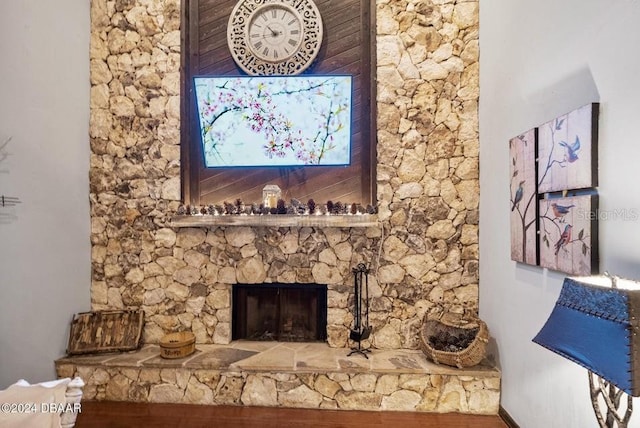 interior details with a stone fireplace