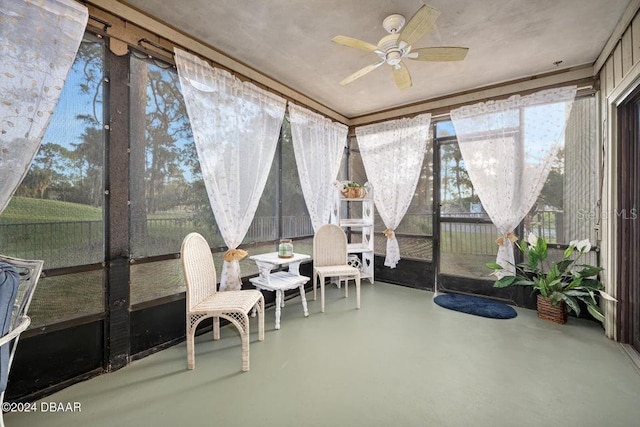 sunroom / solarium with ceiling fan